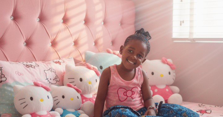 Inside a cozy, pastel-themed Hello Kitty bedroom.